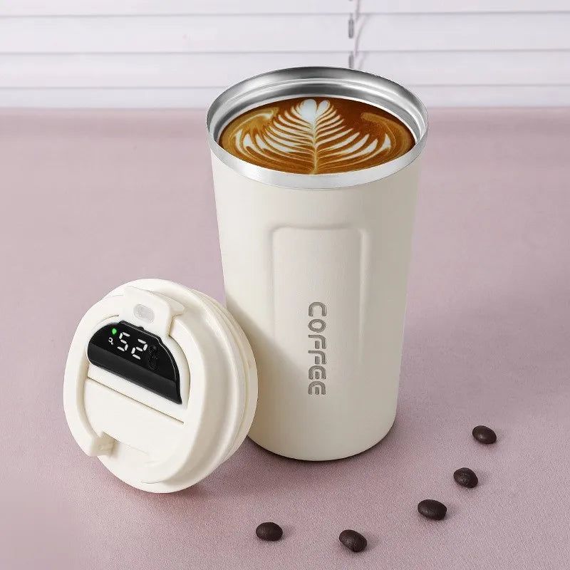 ☕💡 Smart Coffee Tumbler – 380ML / 510ML Sleek, smart & spill-proof! 🌡️ LED temp display 🧊 Keeps drinks hot or cold 🧵 Comes with portable rope for easy carry Perfect for travel, work, or daily sips! 🚶‍♂️🚗🔥